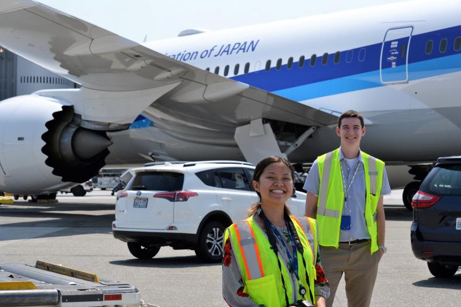 Interns in front of a jet