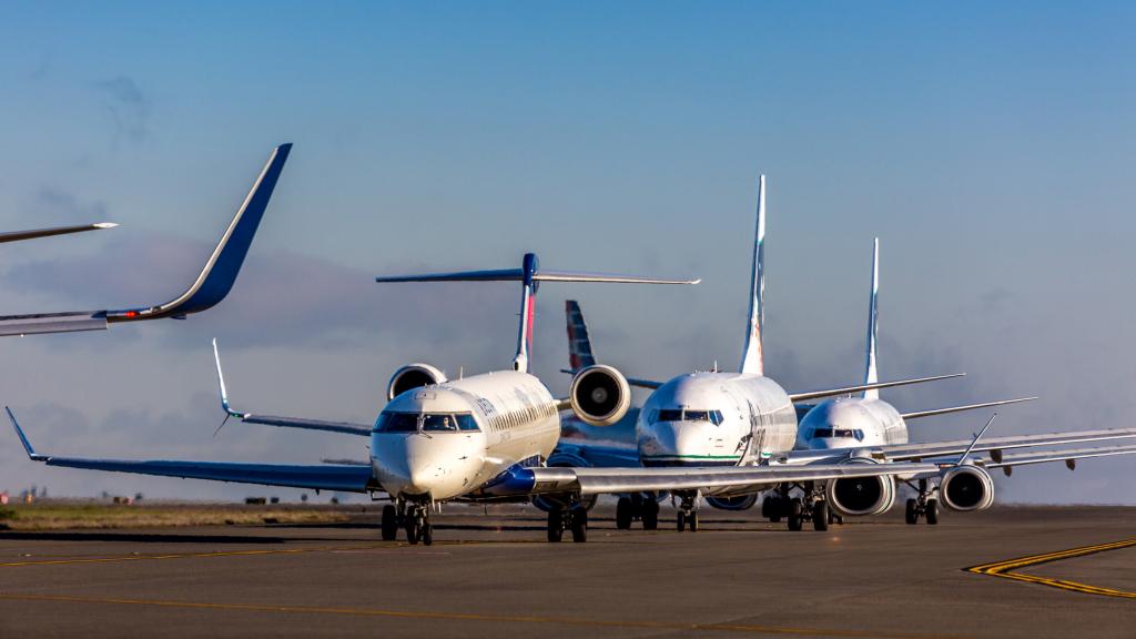 Planes at Sea-Tac Airport await takeoff on the taxiway